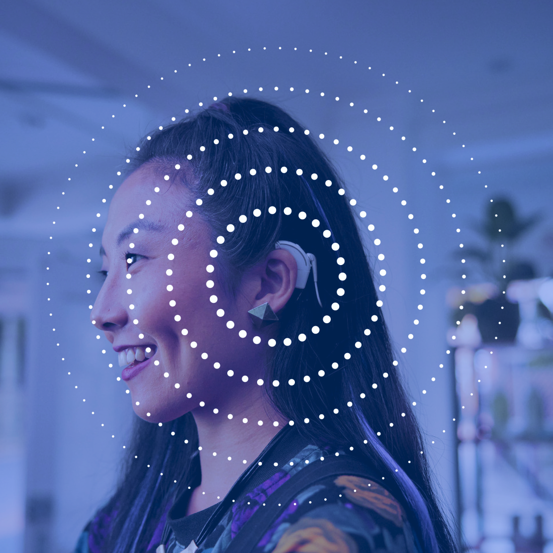 Photo of a woman wearing a Cochlear hearing aid